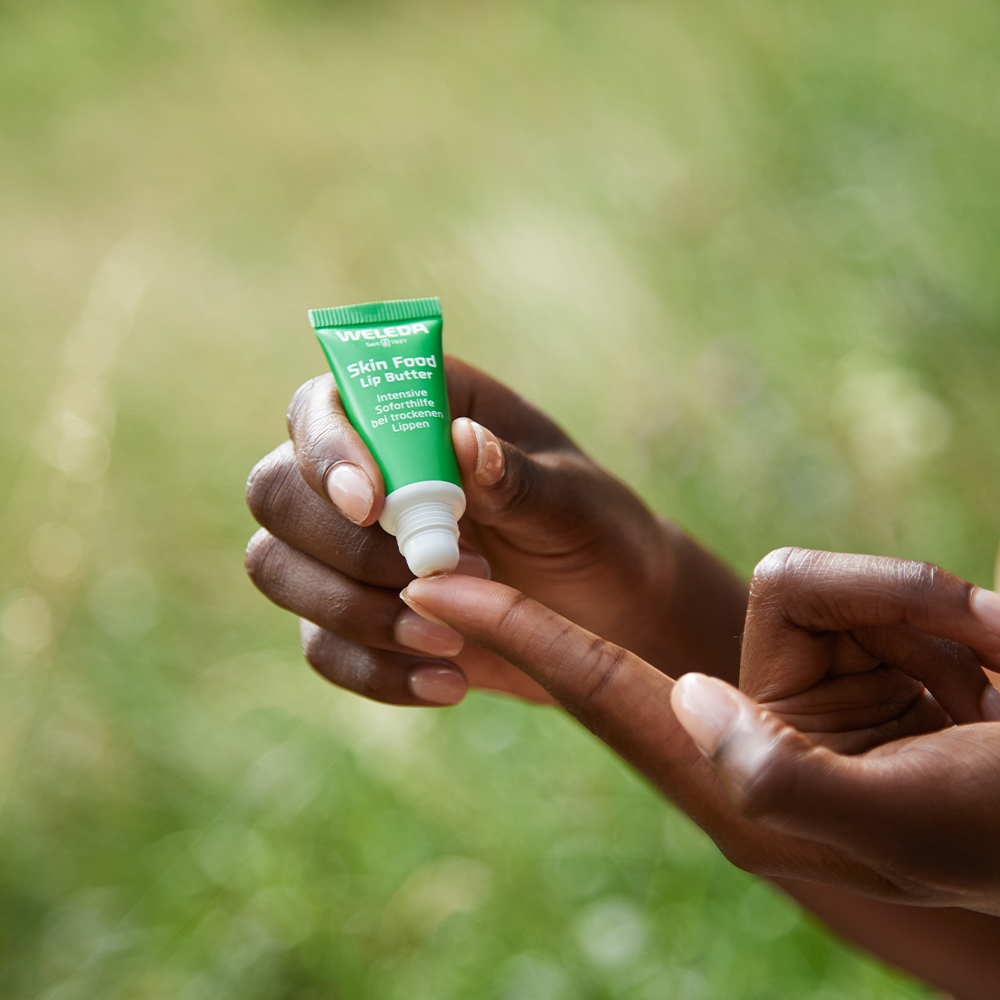 Skin Food Lip Balm on finger Skin Food Lip Balm on finger