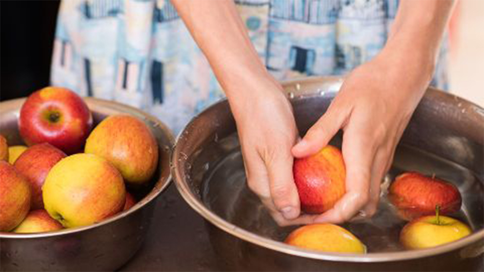 Woman washing apples