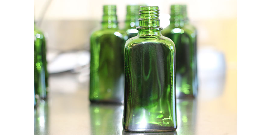 Weleda Sustainable Green Glass Bottles